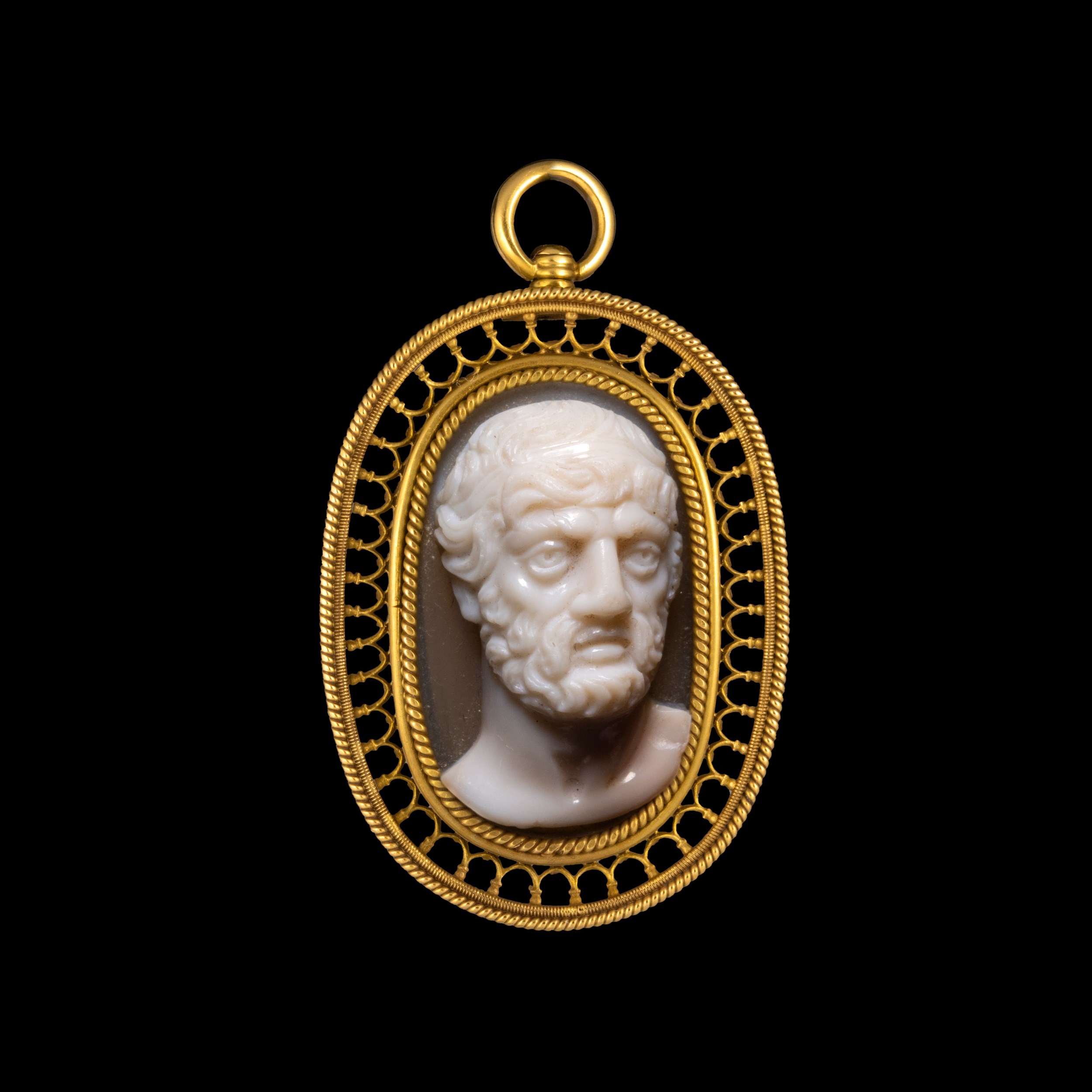 A Neoclassical gold pendant set with a large agate cameo. Bust of a philosopher. 